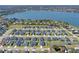 An expansive aerial view captures a beautifully designed community near the serene water offering picturesque scenery at 925 First Dr, Eagle Lake, FL 33839