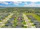 New homes are surrounded by lush landscaping and greenery, creating a peaceful and inviting atmosphere with water views at 925 First Dr, Eagle Lake, FL 33839