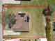Home featuring solar panels, a spacious backyard, and mature trees, nestled in a friendly neighborhood with a clear boundary line at 124 Brandy Chase Blvd, Winter Haven, FL 33880
