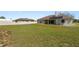 Expansive backyard featuring a white fence and plenty of room to roam at 124 Brandy Chase Blvd, Winter Haven, FL 33880