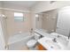 Bathroom featuring a shower-tub combo, vanity, and medicine cabinet for storage at 124 Brandy Chase Blvd, Winter Haven, FL 33880