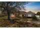 Charming single-story home featuring stone accents, mature landscaping, and a welcoming entrance at 124 Brandy Chase Blvd, Winter Haven, FL 33880
