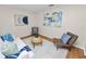 Cozy living room with modern decor, a patterned rug, and wood laminate flooring at 124 Brandy Chase Blvd, Winter Haven, FL 33880