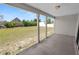 Inviting covered patio overlooking the spacious backyard, ideal for relaxing and enjoying the outdoors at 124 Brandy Chase Blvd, Winter Haven, FL 33880