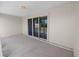 Cozy covered patio featuring sliding glass doors, offering seamless indoor-outdoor living and natural light at 124 Brandy Chase Blvd, Winter Haven, FL 33880