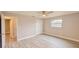 Bright bedroom featuring modern floors and updated walls at 135 Kenilwood Ln, Lakeland, FL 33809