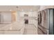 Kitchen with stainless steel appliances, spacious island and counter seating at 135 Kenilwood Ln, Lakeland, FL 33809