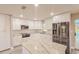 Open kitchen featuring granite countertops, stainless steel appliances, and ample cabinet space at 135 Kenilwood Ln, Lakeland, FL 33809