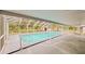 The screened-in pool includes handrails and a covered deck area at 135 Kenilwood Ln, Lakeland, FL 33809