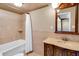 Bathroom featuring a vanity with cream counter and shower with white shower curtain at 14 Casarena Ct, Winter Haven, FL 33881