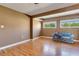 The spacious living room features two large windows and hardwood floors at 14 Casarena Ct, Winter Haven, FL 33881
