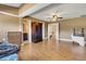 Hardwood flooring and ceiling fans add to the appeal of the living room at 14 Casarena Ct, Winter Haven, FL 33881