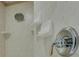 The shower is clean and well-maintained with a white tiled shower and chrome fixtures at 14 Casarena Ct, Winter Haven, FL 33881