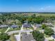 Aerial view of the home, showcasing its location within a tranquil, tree-lined neighborhood at 152 Melissa Trl, Auburndale, FL 33823