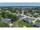 An aerial view of the property, showcasing its well-maintained landscaping and a pool enclosure at 152 Melissa Trl, Auburndale, FL 33823