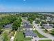 An aerial view of a home, showing its neighborhood and nearby lake at 152 Melissa Trl, Auburndale, FL 33823