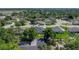 An aerial perspective of a home nestled in a leafy suburban setting at 152 Melissa Trl, Auburndale, FL 33823
