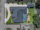 Top-down aerial view of a single-Gathering home showcasing the screened-in pool, gray roof, and lush backyard at 152 Melissa Trl, Auburndale, FL 33823