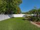 Expansive, well-maintained backyard with healthy green lawn, privacy fence, and mature landscaping at 152 Melissa Trl, Auburndale, FL 33823
