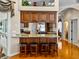 Kitchen bar with granite countertop and bar stool seating, situated adjacent to another kitchen area at 152 Melissa Trl, Auburndale, FL 33823
