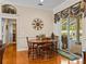 Bright dining room featuring wood floors, table and chairs, and sliding glass doors to the outdoor pool area at 152 Melissa Trl, Auburndale, FL 33823