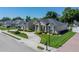 Well-maintained single-Gathering home with manicured landscaping, a circular driveway, and a tidy front lawn at 152 Melissa Trl, Auburndale, FL 33823
