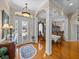 Spacious foyer showcasing detailed archways, decorative chandelier, and hardwood floors at 152 Melissa Trl, Auburndale, FL 33823