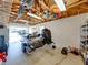 Garage interior featuring a fishing boat on a trailer, overhead storage, and open door at 152 Melissa Trl, Auburndale, FL 33823