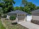 A detached garage with manicured landscaping adds curb appeal to this charming residential property at 152 Melissa Trl, Auburndale, FL 33823