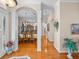 Hallway featuring decorative light fixtures and hardwood floors at 152 Melissa Trl, Auburndale, FL 33823