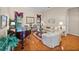 Cozy living room with hardwood floors, piano, and comfortable seating at 152 Melissa Trl, Auburndale, FL 33823