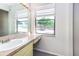 Bathroom featuring a single sink vanity and a large window providing natural light at 1880 N Crystal Lake Dr # 35, Lakeland, FL 33801