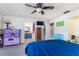 Bedroom with ceiling fan leads to bathroom and closet spaces at 1880 N Crystal Lake Dr # 35, Lakeland, FL 33801