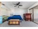 Bedroom with sliding glass door to balcony with ceiling fan, and carpeted floors at 1880 N Crystal Lake Dr # 35, Lakeland, FL 33801