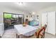 Bright dining room with sliding glass doors leading to the outdoor patio and views of the garden at 1880 N Crystal Lake Dr # 35, Lakeland, FL 33801