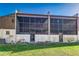 View of back of home featuring enclosed patios and second floor balconies at 1880 N Crystal Lake Dr # 35, Lakeland, FL 33801