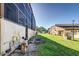 View of back of home featuring enclosed patios and a grassy yard at 1880 N Crystal Lake Dr # 35, Lakeland, FL 33801