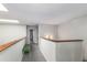 Well lit hallway with railing and skylight; bench on one side at 1880 N Crystal Lake Dr # 35, Lakeland, FL 33801