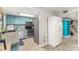 Well-equipped kitchen boasting stainless steel appliances, stylish blue cabinetry, and durable countertops at 1880 N Crystal Lake Dr # 35, Lakeland, FL 33801