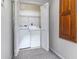 Closet style laundry room with front load washer and dryer with folding doors at 1880 N Crystal Lake Dr # 35, Lakeland, FL 33801