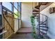 Patio with a hot tub and spiral staircase to the second floor at 1880 N Crystal Lake Dr # 35, Lakeland, FL 33801
