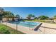 Community pool with a bath house in a fenced in area at 1880 N Crystal Lake Dr # 35, Lakeland, FL 33801