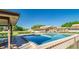 Community pool with seating areas and nearby houses at 1880 N Crystal Lake Dr # 35, Lakeland, FL 33801