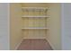 Storage closet with 3 shelves in the main bedroom at 1939 Prairie Dunes N Cir, Lakeland, FL 33810