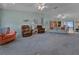 Spacious living room featuring carpet, and a view to the dining room at 1939 Prairie Dunes N Cir, Lakeland, FL 33810