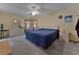 Comfortable main bedroom with a ceiling fan, neutral carpet, and a window for natural light at 1939 Prairie Dunes N Cir, Lakeland, FL 33810