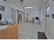 Bright office space featuring tile flooring, neutral walls, and sliding door access to another room at 1939 Prairie Dunes N Cir, Lakeland, FL 33810