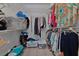 Bright walk-in closet with wire shelving and rods to maximize storage and organization options at 1939 Prairie Dunes N Cir, Lakeland, FL 33810