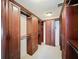 Walk-in closet with custom wooden storage, shelving, drawers, and hanging rods at 2605 Nevada Rd, Lakeland, FL 33803