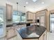 Large kitchen with granite countertops and an island cooktop for added convenience at 2605 Nevada Rd, Lakeland, FL 33803